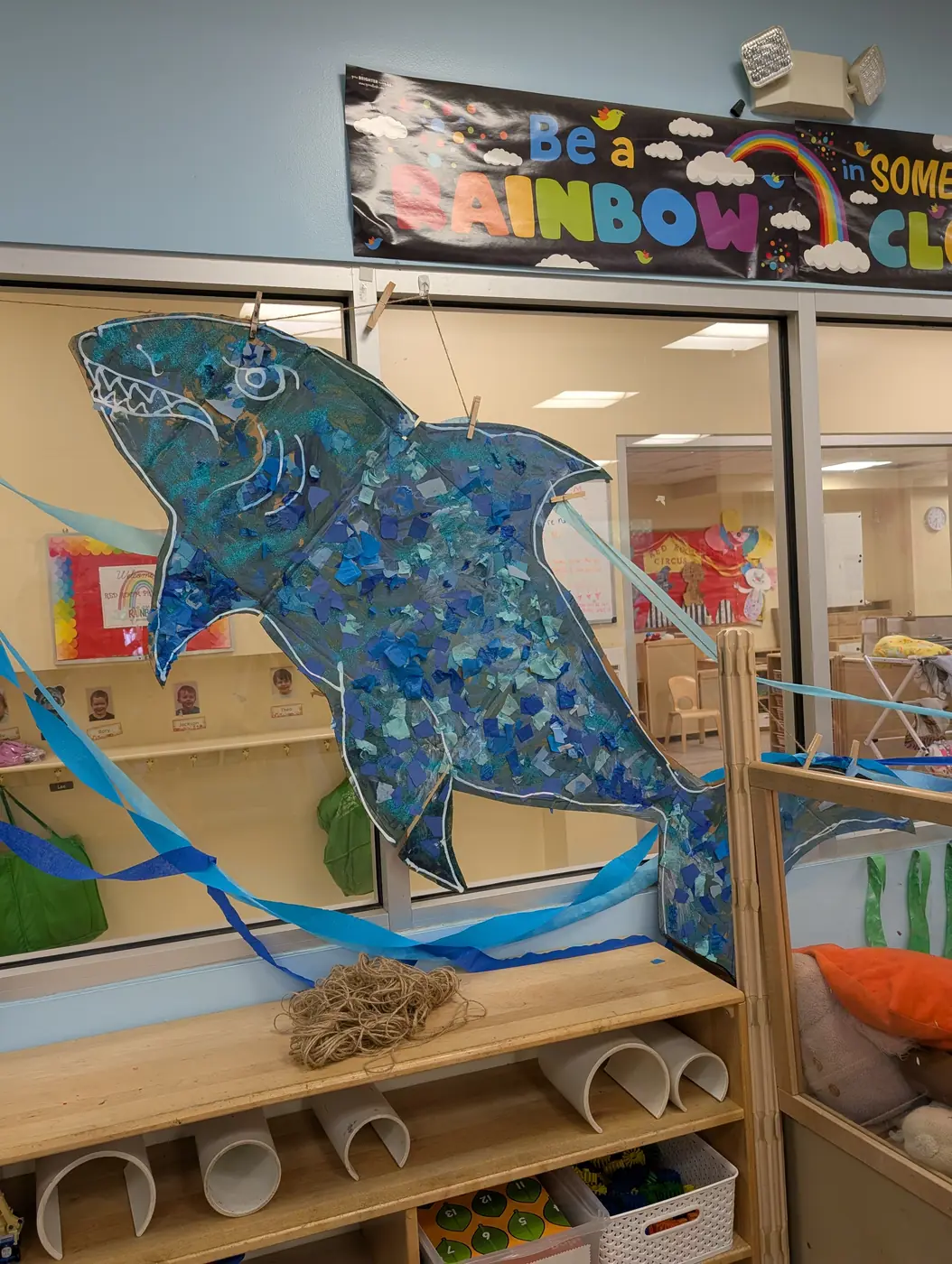 The collaborative tissue-paper shark mural from the summer under-the-sea theme